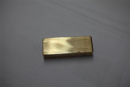 A 1960s 9ct gold Dunhill lighter, approx. 2.5in.